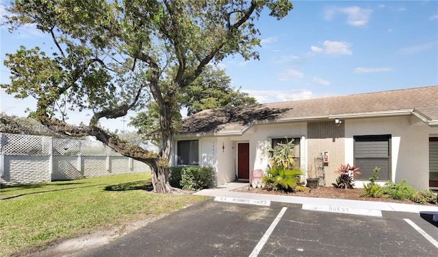 view of front of property with a front lawn