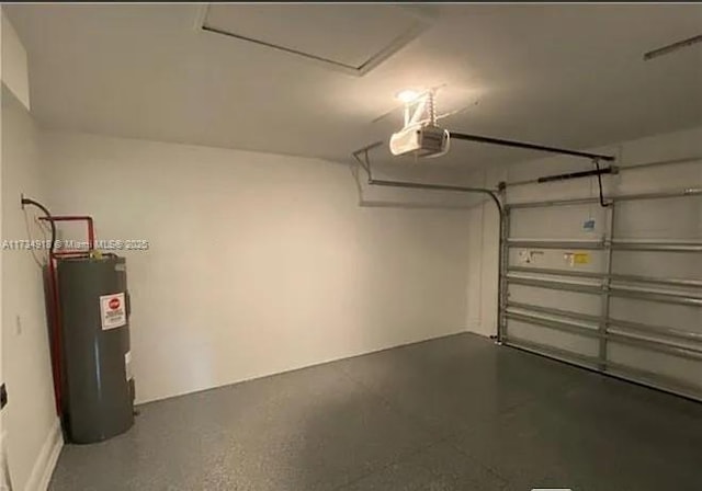 garage with a garage door opener and electric water heater