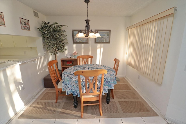 dining area featuring a chandelier