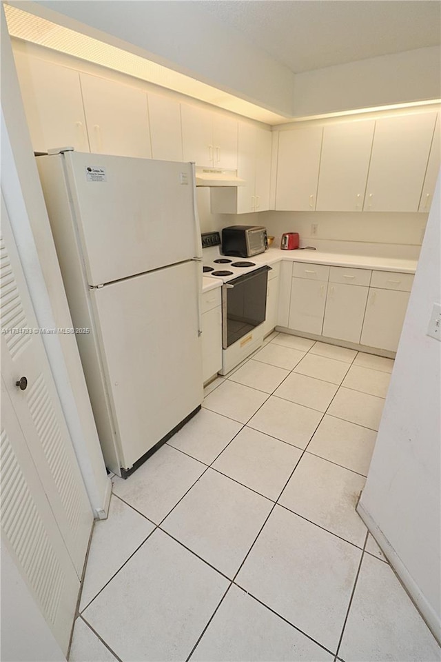 kitchen featuring white cabinetry, white appliances, and light tile patterned floors