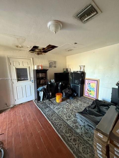 living room with dark hardwood / wood-style floors