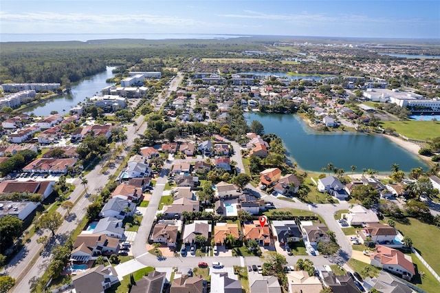 birds eye view of property featuring a water view