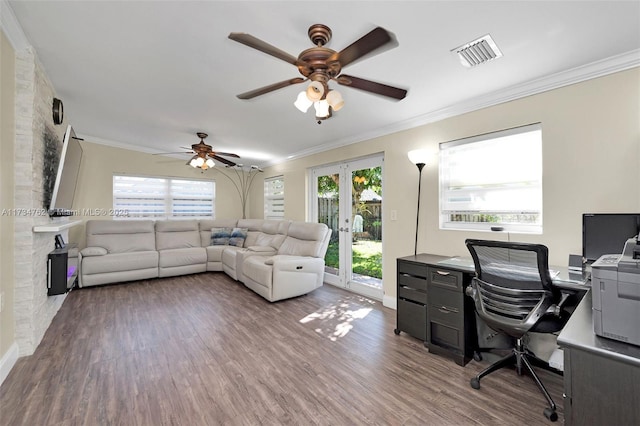 home office with ornamental molding, a healthy amount of sunlight, hardwood / wood-style floors, and french doors