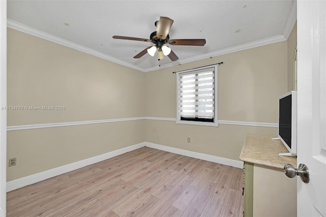 unfurnished room featuring ornamental molding, ceiling fan, and light hardwood / wood-style flooring