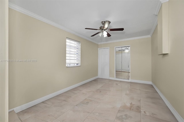 spare room featuring crown molding and ceiling fan