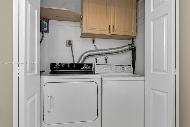 laundry room with cabinets and separate washer and dryer