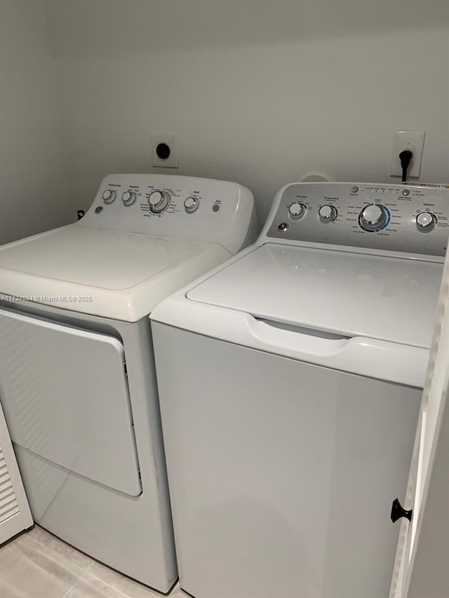 washroom featuring independent washer and dryer