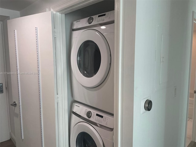 laundry room featuring stacked washer and clothes dryer