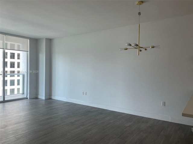 empty room with dark wood-type flooring