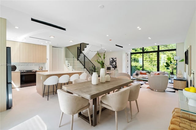 dining area with a wall of windows