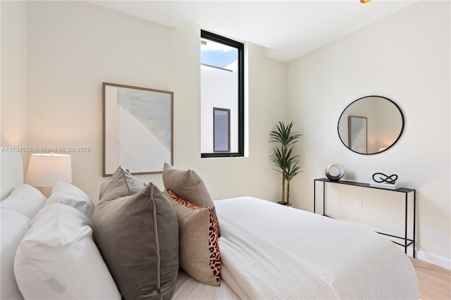 bedroom with light hardwood / wood-style flooring