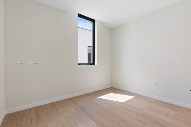 unfurnished room featuring light hardwood / wood-style floors