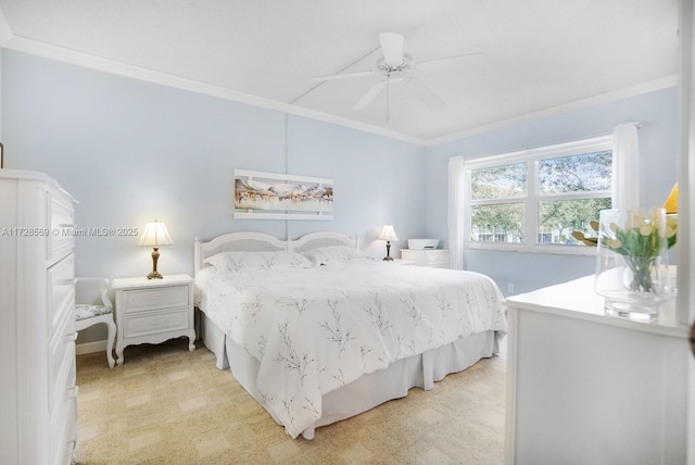 carpeted bedroom with crown molding and ceiling fan