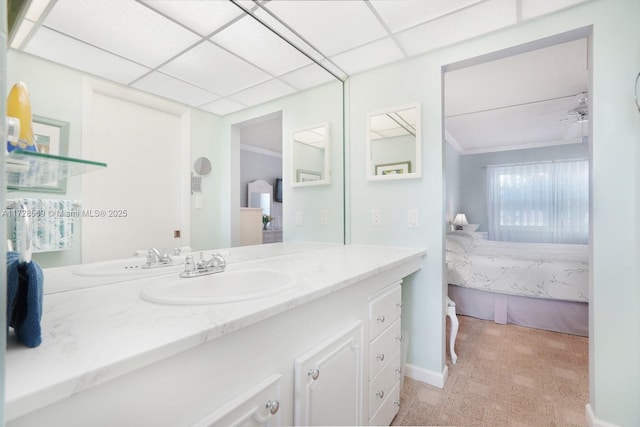 bathroom with vanity and a drop ceiling