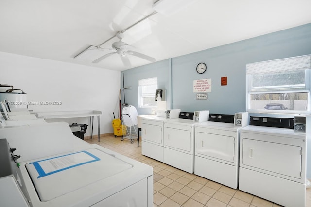 laundry room featuring light tile patterned flooring, ceiling fan, and separate washer and dryer