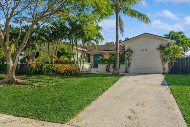 single story home featuring a garage and a front lawn