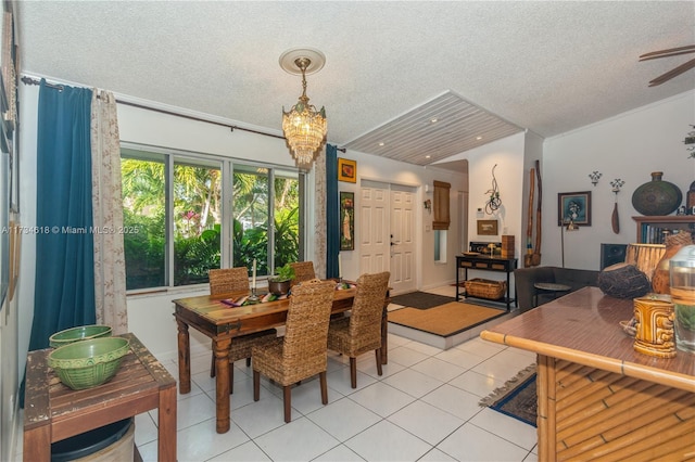 dining room featuring an inviting chandelier, light tile patterned floors, and a textured ceiling