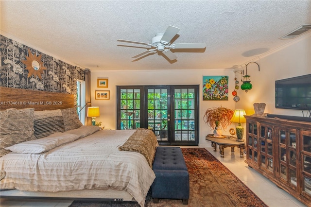 bedroom featuring ceiling fan, access to exterior, a textured ceiling, and french doors