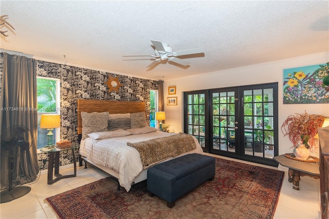 tiled bedroom featuring multiple windows, french doors, and a textured ceiling