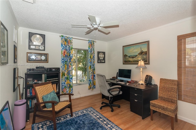 office space featuring hardwood / wood-style floors, ornamental molding, a textured ceiling, and ceiling fan