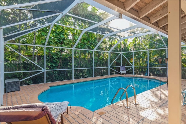 view of pool featuring a lanai and a patio area