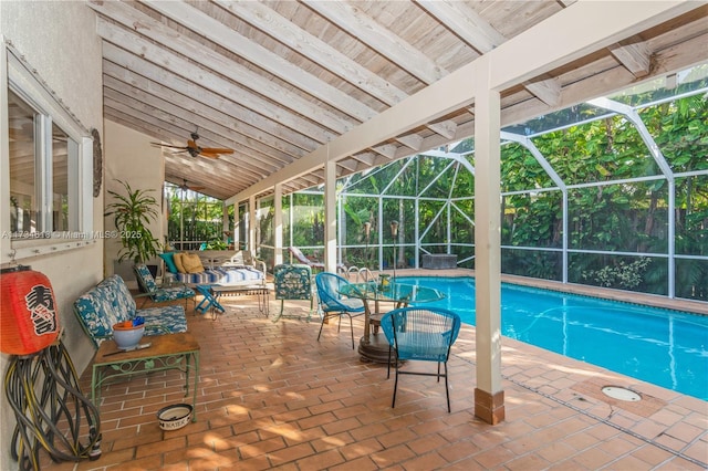 view of swimming pool with an outdoor hangout area, a lanai, a patio area, and ceiling fan