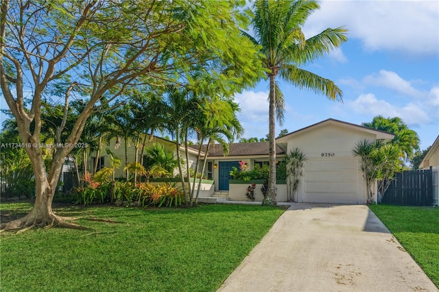 ranch-style house with a garage and a front lawn