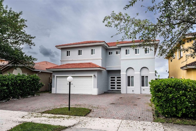 mediterranean / spanish-style house featuring a garage