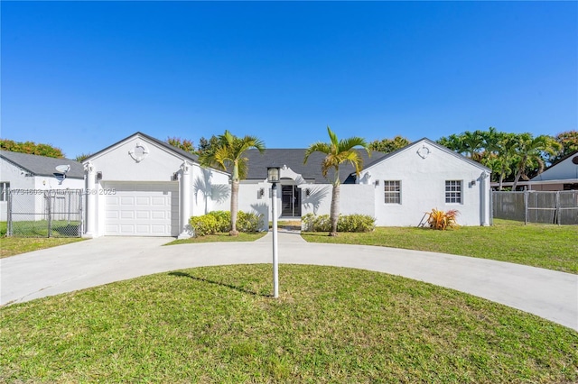 view of front of house with a garage and a front lawn