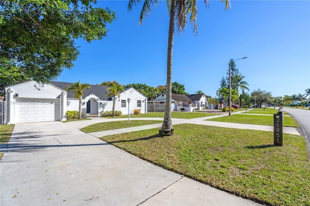 single story home featuring a garage and a front yard