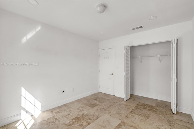 unfurnished bedroom featuring a closet