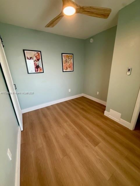 unfurnished room featuring ceiling fan and light hardwood / wood-style floors