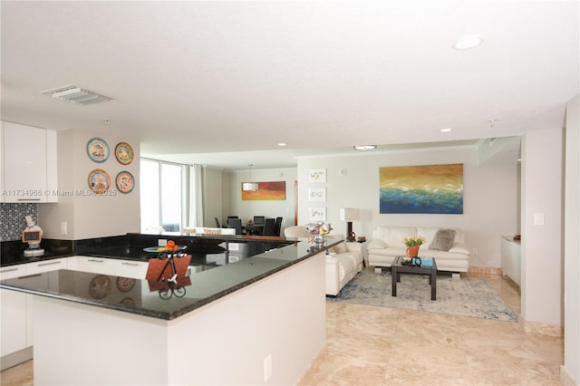 kitchen featuring a center island and white cabinets