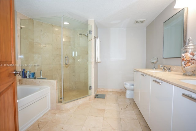 full bathroom with vanity, a textured ceiling, shower with separate bathtub, and toilet