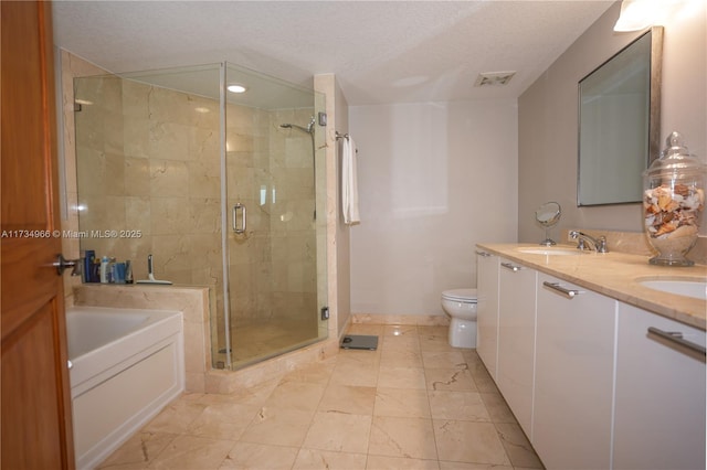 full bathroom featuring vanity, a textured ceiling, toilet, and separate shower and tub