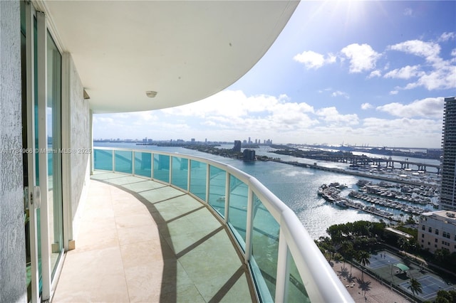 balcony featuring a water view