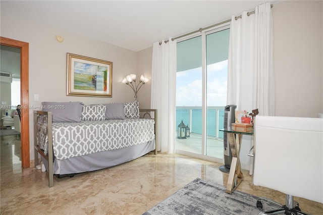 bedroom featuring a water view and access to exterior