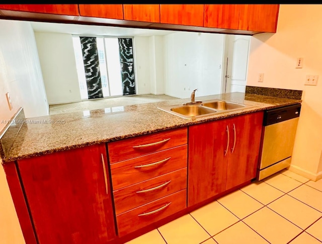 kitchen featuring light stone counters, dishwasher, sink, and light tile patterned floors