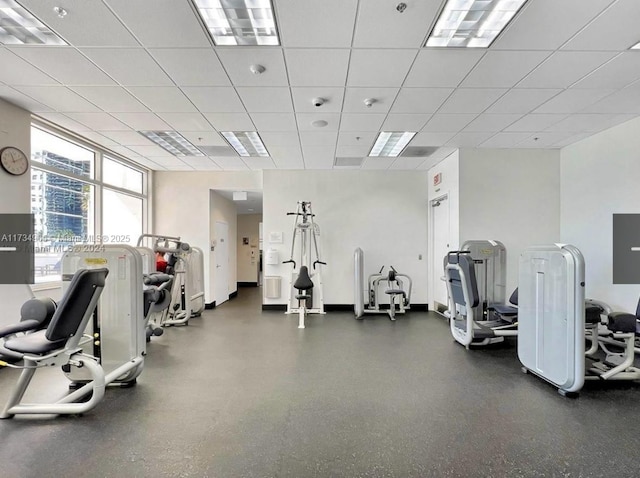 exercise room featuring a drop ceiling