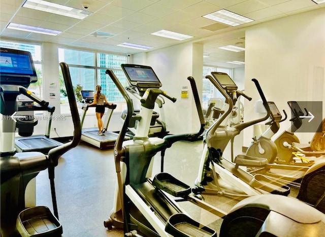 exercise room with a drop ceiling