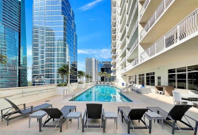 view of swimming pool with a patio area