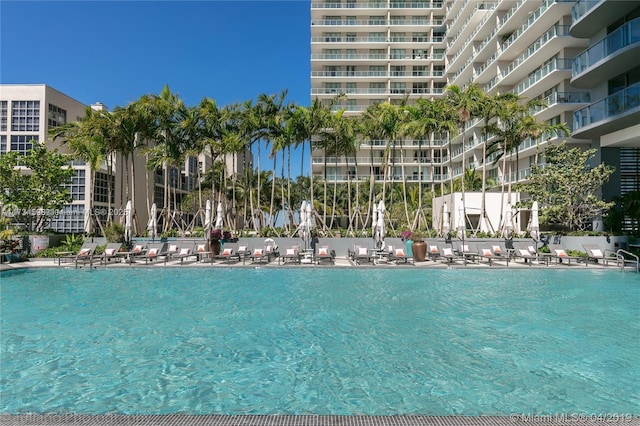 view of pool with a water view