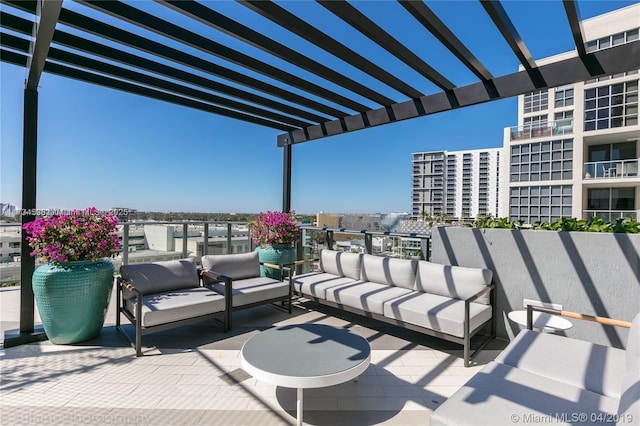 view of patio / terrace with an outdoor living space and a pergola