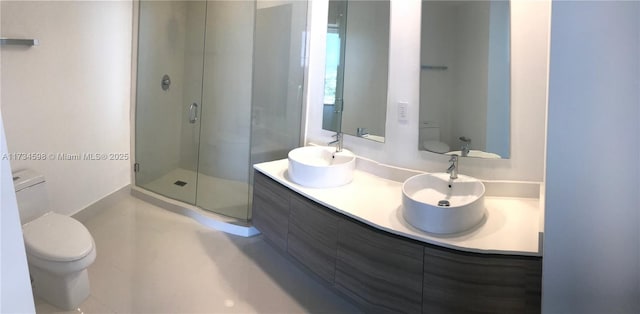 bathroom featuring walk in shower, vanity, and toilet