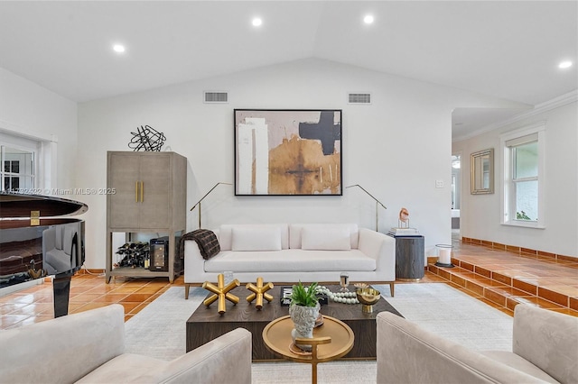 living room featuring light tile patterned flooring and vaulted ceiling