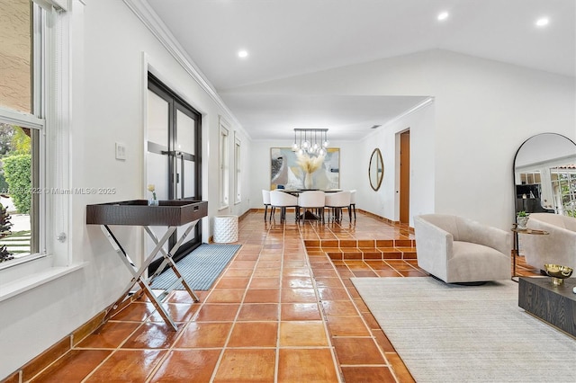 tiled living room with ornamental molding, lofted ceiling, and a chandelier