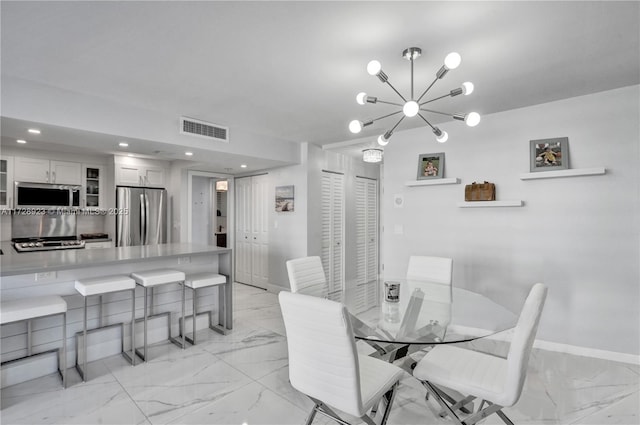 dining space with a notable chandelier