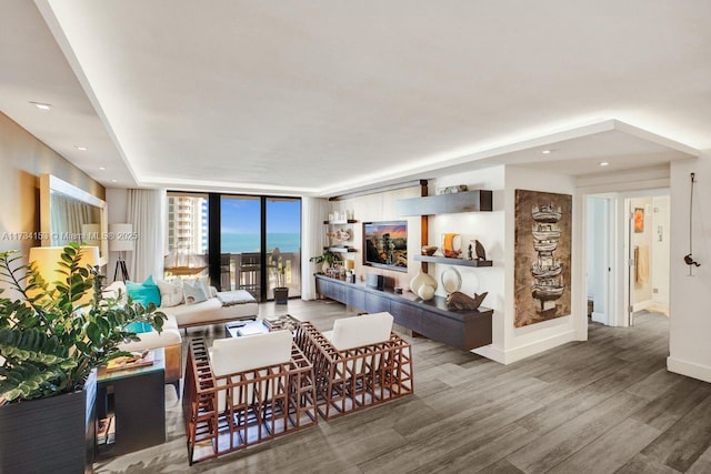 1121 Crandon Blvd Unit D706, Key Biscayne, FL 33149 - living room featuring recessed lighting, expansive windows, wood finished floors, and baseboards