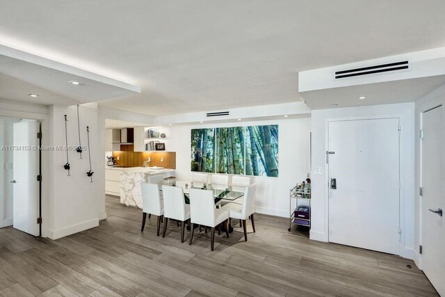 1121 Crandon Blvd Unit D706, Key Biscayne, FL 33149 - dining space with baseboards, wood finished floors, visible vents, and recessed lighting