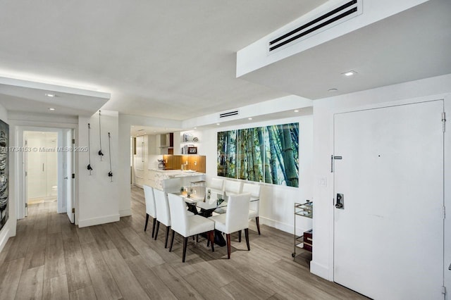 1121 Crandon Blvd Unit D706, Key Biscayne, FL 33149 - dining room featuring recessed lighting, wood finished floors, visible vents, and baseboards